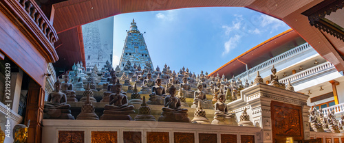 View of statues of sitting Buddhas at Gangaramaya Temple, Colombo, Sri Lanka