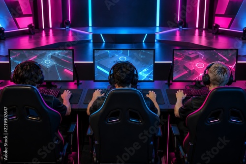 An Esports Team Seen from Behind in a Gaming Arena