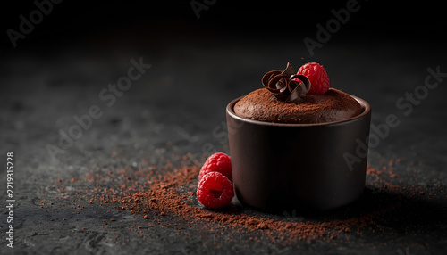 Elegant Dark Chocolate Mousse Dessert with Fresh Raspberries.