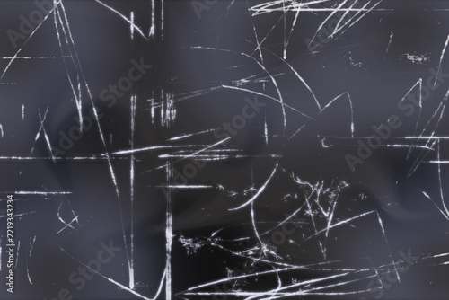 Abstract scratched texture overlay with white lines on a dark black background illustration