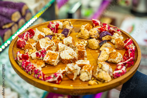 Wooden platter holds colorful, chunky sweet treats
