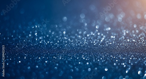 Abstract Blue Glitter Sparkle Background with Bokeh Effect.