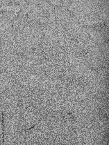 Rough textured gray wall surface with granular and uneven coating