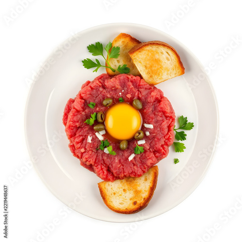 Traditional Belgian filet américain raw minced beef spread with capers and egg yolk isolated on white background.