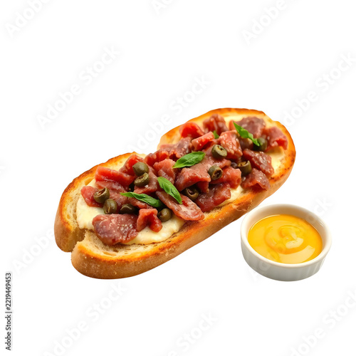 Traditional Belgian filet américain raw minced beef spread with capers and egg yolk isolated on white background.