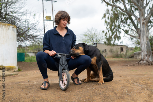 Woman seen sitting on plastic bike