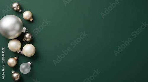 Assorted metallic christmas baubles on green background isolated on white background