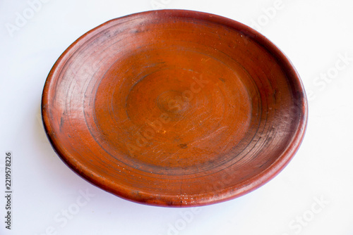 earthenware plate isolated on white background. earthenware crafts