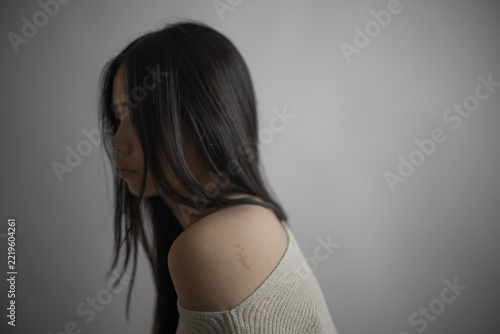 Thoughtful Southeast Asian woman portrait with long black hair