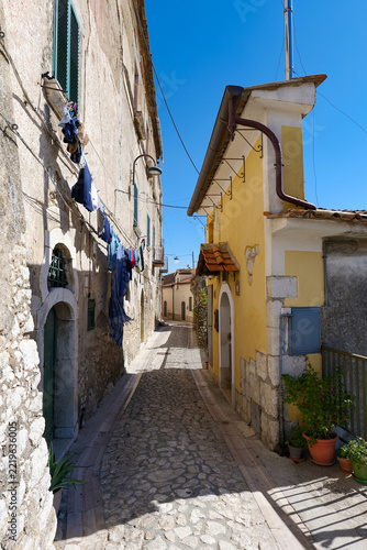 A narrow street winding between the old buildings of Montesarchio, a medieval town in southern Italy.