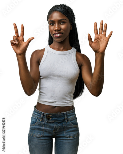 Young african american woman in casual clothes showing number eight with fingers pointing up, happy and smiling in studio