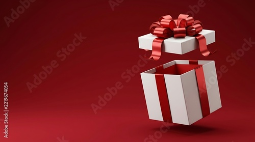 Elegant white gift box with shiny red ribbon floating open against a clean deep burgundy background creating a festive holiday celebration concept view