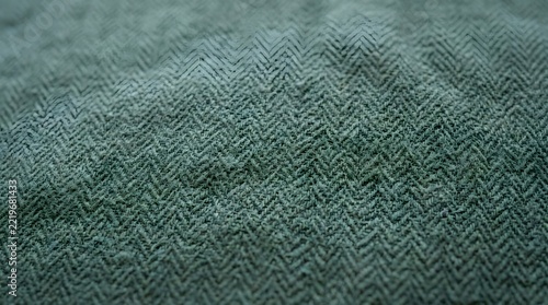 Abstract pixelated green dots on dark background