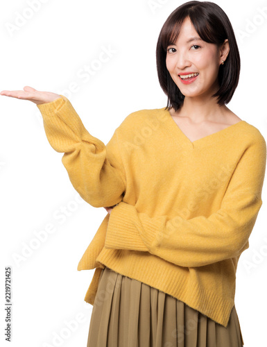 Happy young asian woman presenting copy space with open palm gesture standing against white studio background for artificial intelligence concept advertising
