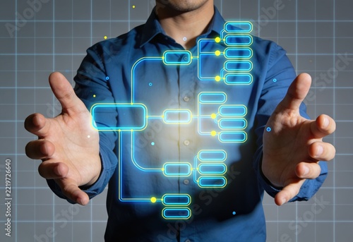 Professional man interacting with futuristic digital network interface overlay on blue