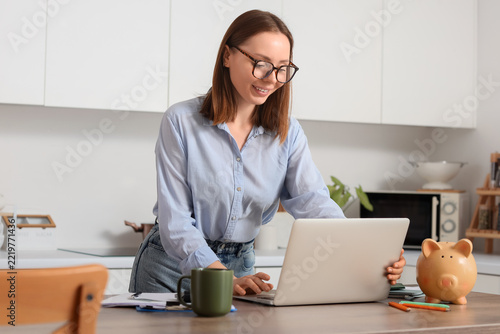 Financial planning and remote work, woman using laptop for personal finance m...