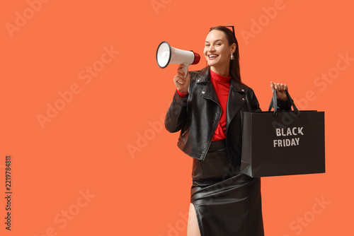 Black Friday sale announcement, happy woman holding shopping bag and megaphone for retail marketing campaign on orange background