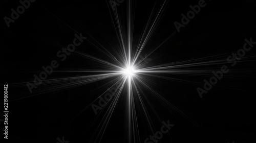 Bright white star burst light effect with shining rays radiating outward across dark night sky background