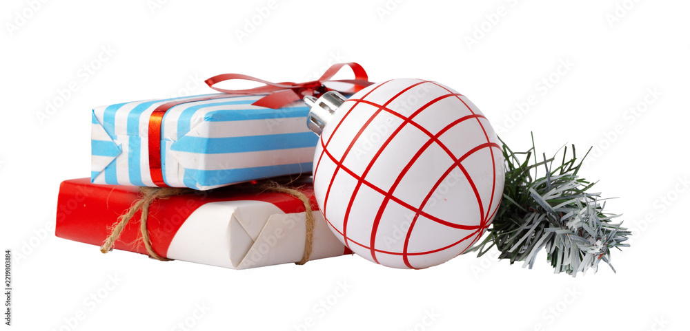Fototapeta premium Colorful Christmas gifts and ornaments on a plain background ready for holiday celebrations