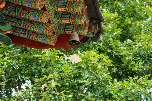 Traditional Wind Chime Punggyeong with Fish Pendant Hanging Under Temple Eaves