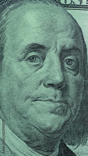 Dollar Bill with Franklin Portrait Under Green Security Scan. Dollar bill with Benjamin Franklin portrait passes through moving green scan light. 