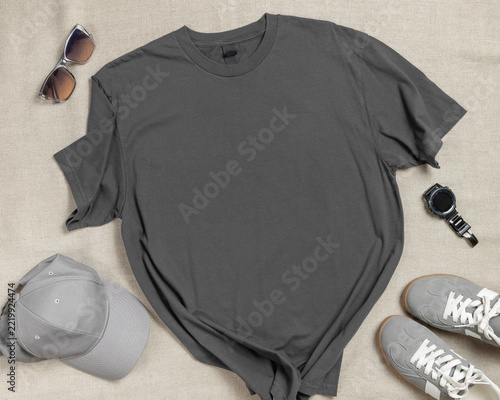 Blank dark grey unisex t-shirt mockup, crewneck flat lay with denim jeans and mens accessories