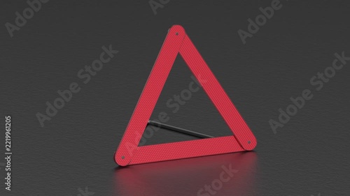 Emergency warning triangle on asphalt road