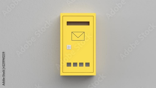 Yellow mailbox on grey wall