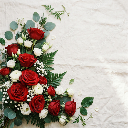 Elegant red and white roses bouquet with greenery for romantic