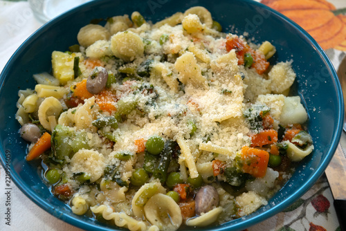 Minestrone soup with pasta and parmesan cheese