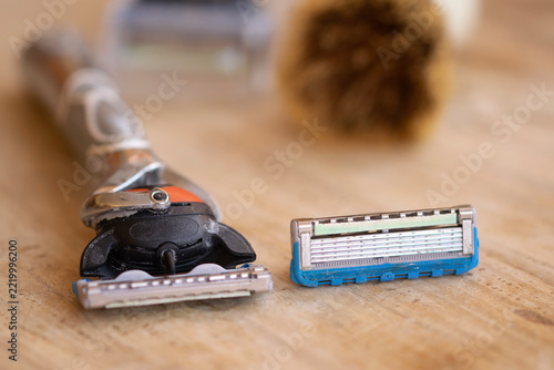 old wet-shaving razor with used replacement blades
