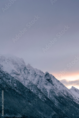 mountains in the snow and norwegian fjord