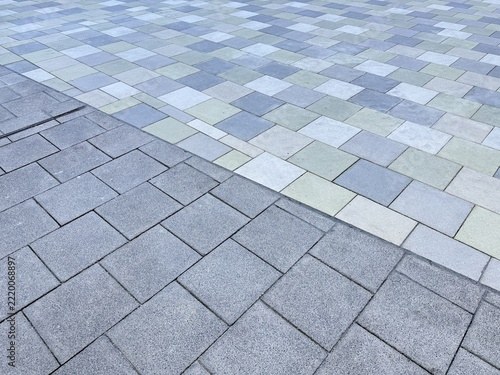 Laying multicolored paving stones/concrete blocks in a gravel bed