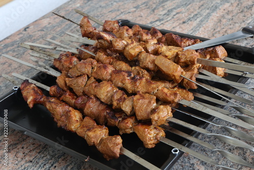 Preparing pork shashlik on the charcoal mangal