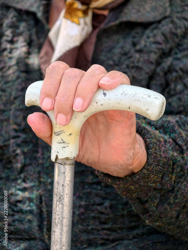 Fotografie Aged woman hand resting on a support cane representing senior assistance daily l