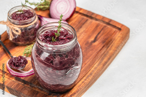 Sliced red onion and caramelized onions served with fresh herbs