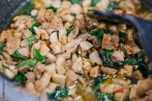 Close-up detail of authentic Thai Pad Kra Pao chicken stir-fry