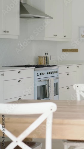 Vertical video: Panning shot from left, camera revealing pale blue range and jars, showing styling
