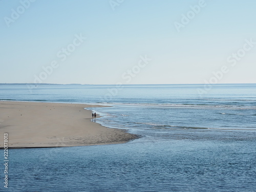 Ogunquit beach in Maine at low tide with distant couple