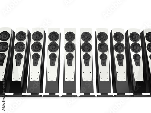 High tower sound speakers with shiny white panels and black base casing - low angle shot