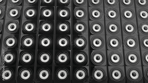 Wall of shiny sub woofer bass speakers with white center canvas