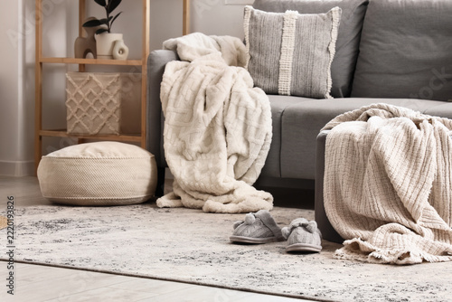 Hygge lifestyle and home comfort, cozy living room interior with soft blanket...