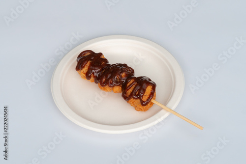 Battered chicken topped with sauce
