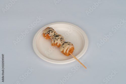 Battered chicken topped with sauce