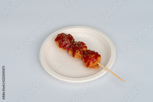 Battered chicken topped with sauce