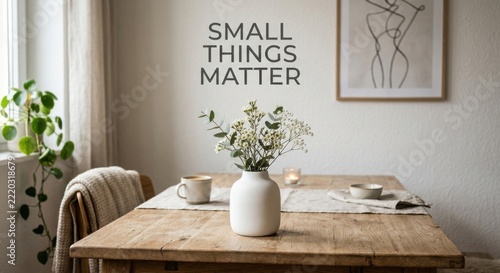 White Ceramic Vase of Delicate Flowers on a Rustic Wooden Table