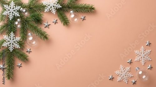 Christmas fir branches and snowflakes frame on beige background