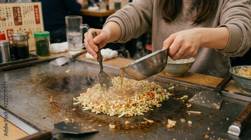 Japan's ultimate soul food: Monjyayaki!
It's a savory, gooey grill dish with irresistible crispy bits.
An interactive Japanese soul food you scrape and eat right off the grill.
Think of it as a gooey,