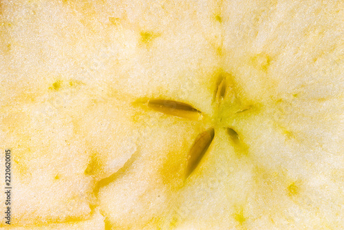 Abstract macro background texture of a thin fresh apple slice