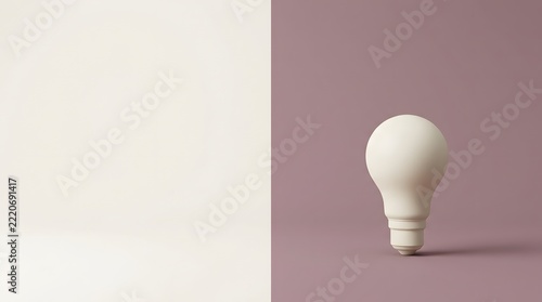 A smooth, cream-colored light bulb rests on a dusty rose surface with a creamy white background, to the left